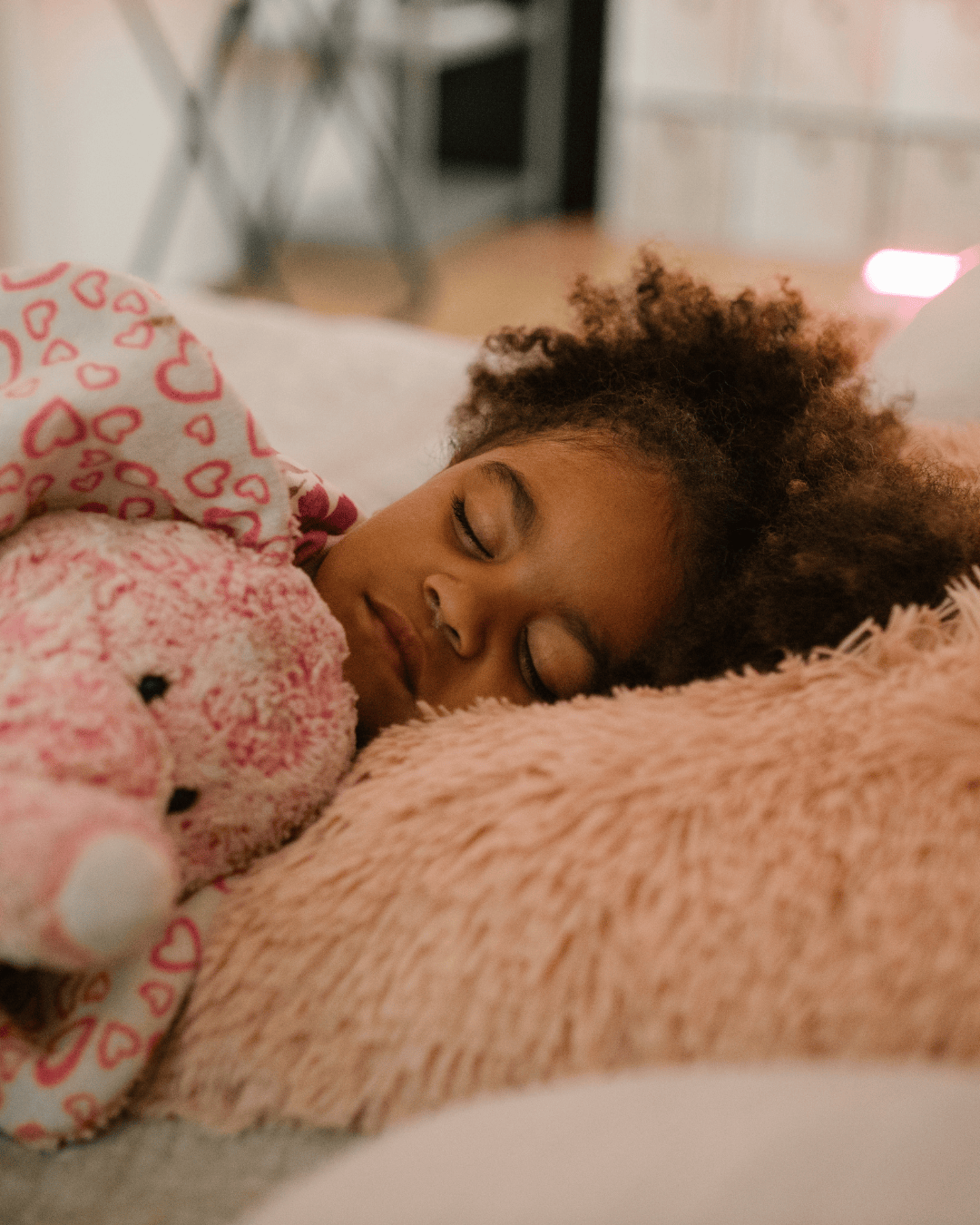 Child sleeping on pillow with mouth closed, showing healthy nasal breathing