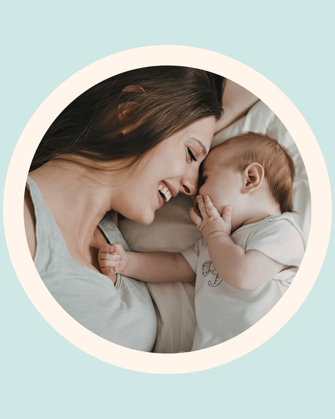 Mother holding her baby in a softly lit nursery, representing early oral health and baby tongue tie education for parents.