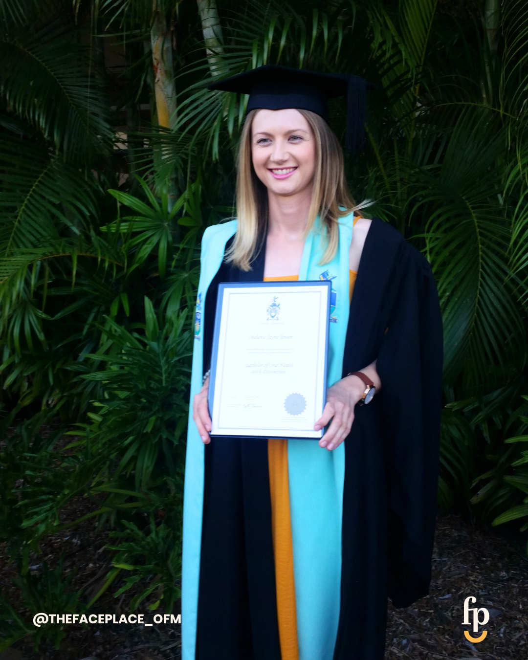 Mel Van Schelven holding her Bachelor of Oral Health degree at graduation — the qualification behind The Face Place's holistic children's dental health and oral function services.