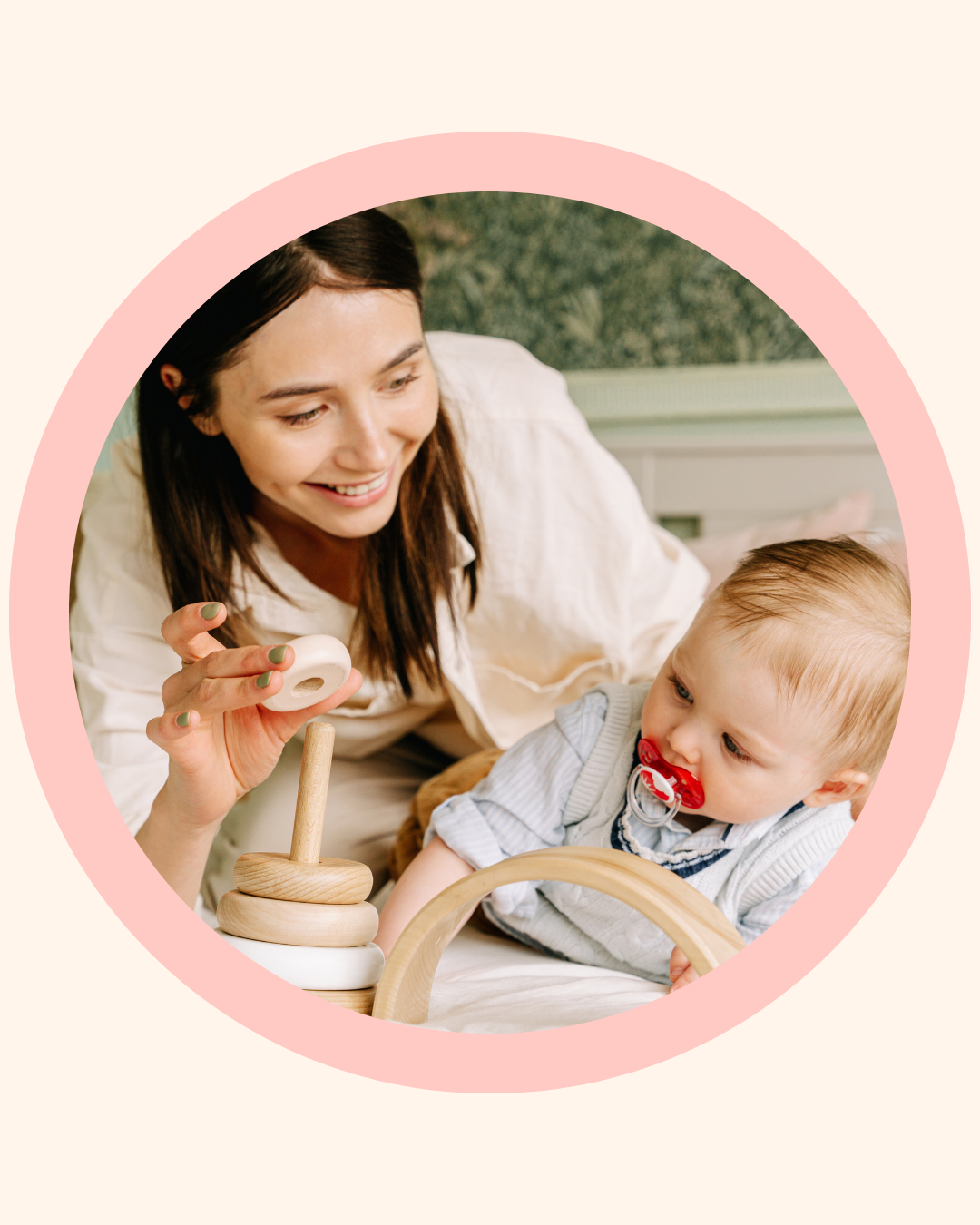 "Mother playing with her toddler who is using a dummy, supporting early development at home