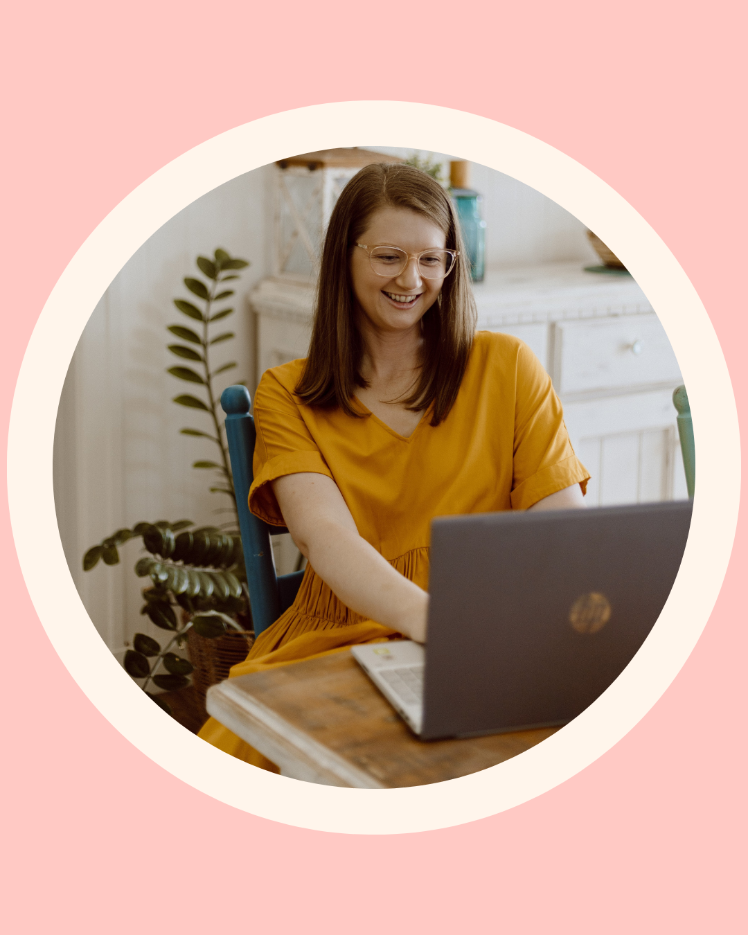 Mel from The Face Place smiling at her laptop during an online children's oral function consultation