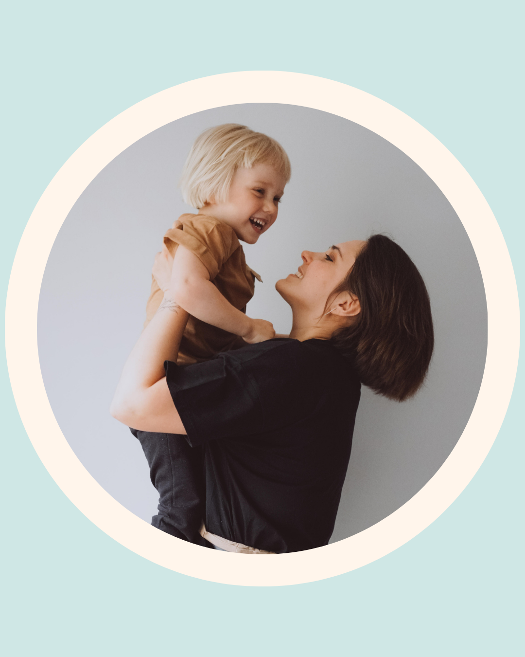 Mother and toddler smiling together during toothbrushing routine – toddler oral hygiene support.